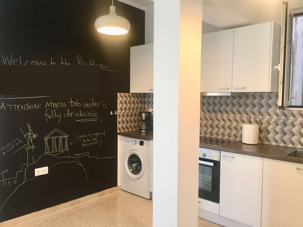 Wide view of the kitchen with washing machine and oven, Monastiraki, Athens
